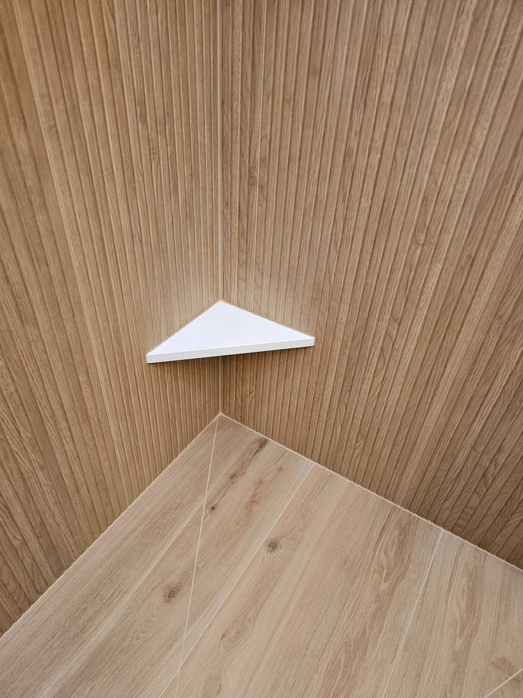 Custom corner shower shelf — bathroom remodel Barrington IL