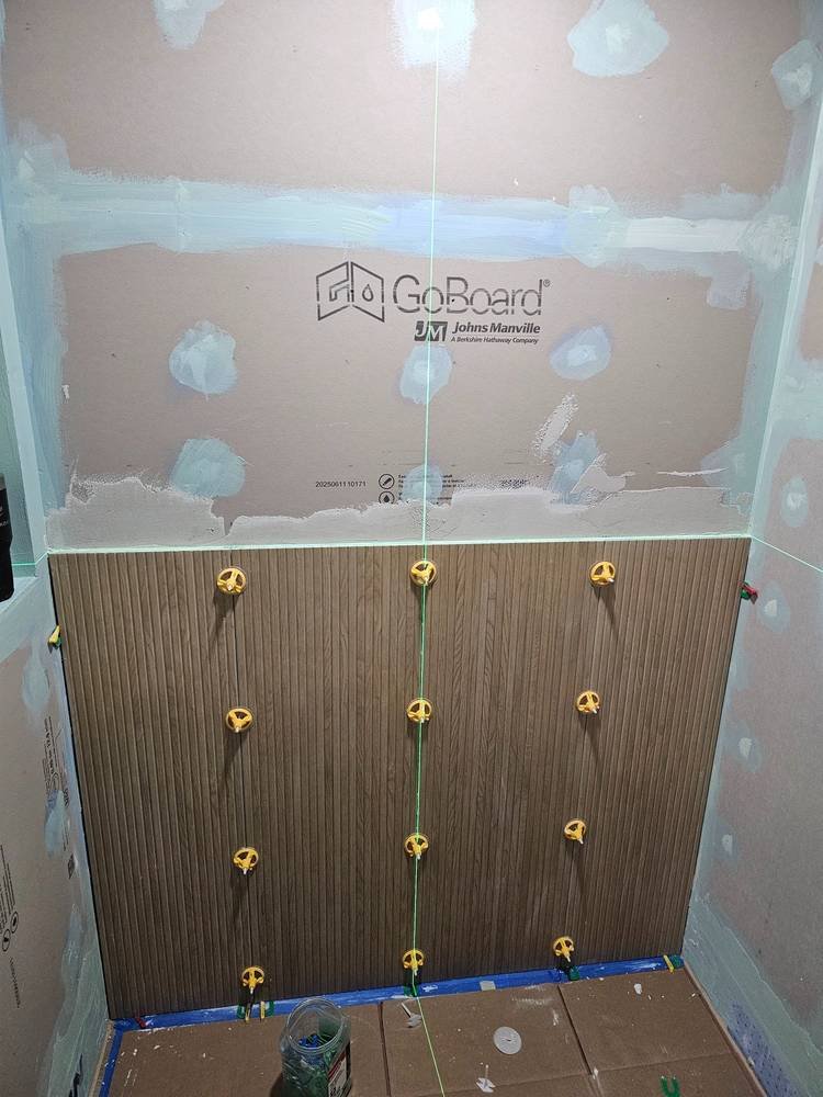 Shower wall tile progress with leveling system — Barrington IL