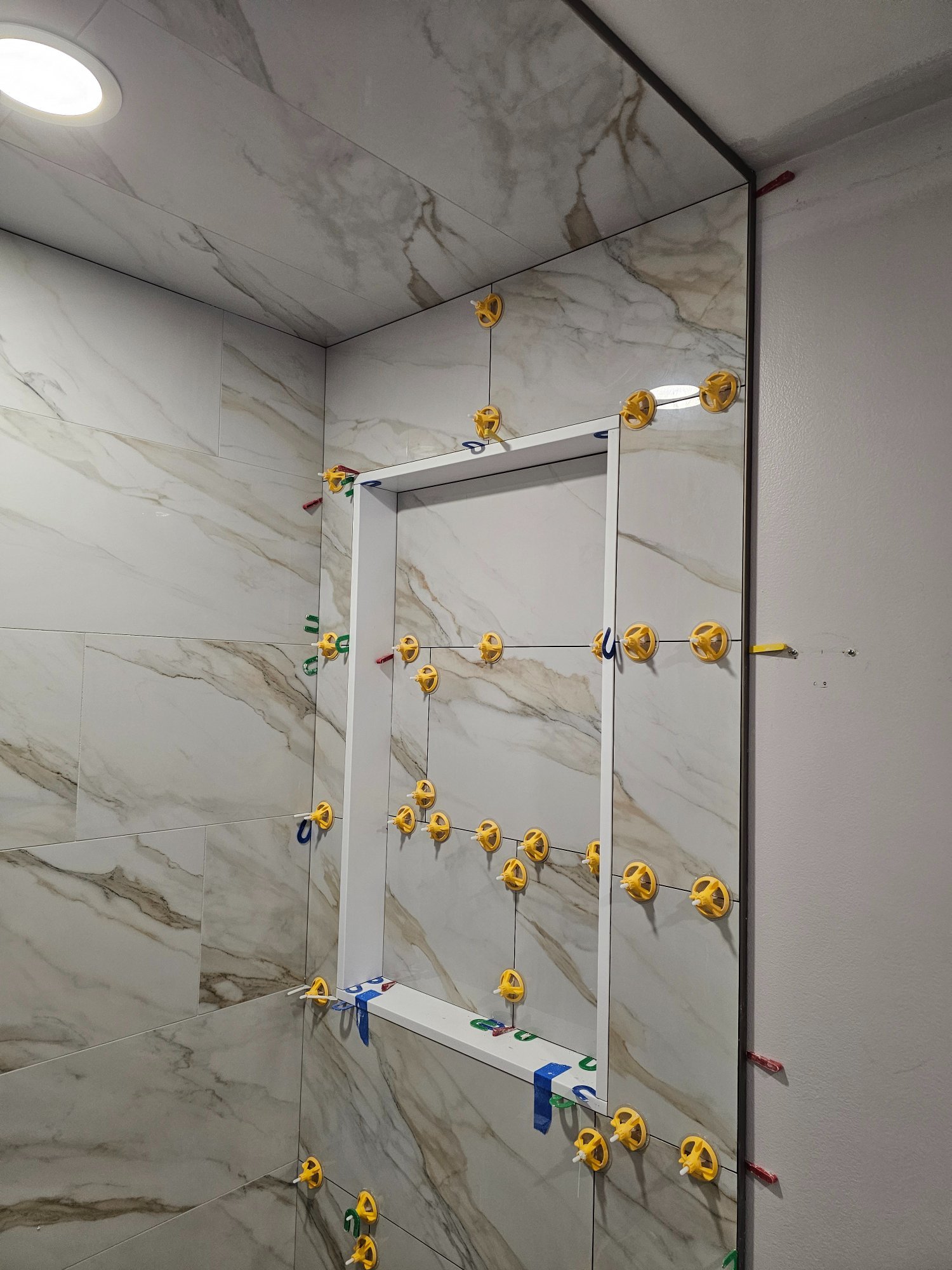 Ceiling tile installation — Calacatta carried to the ceiling — Inverness IL