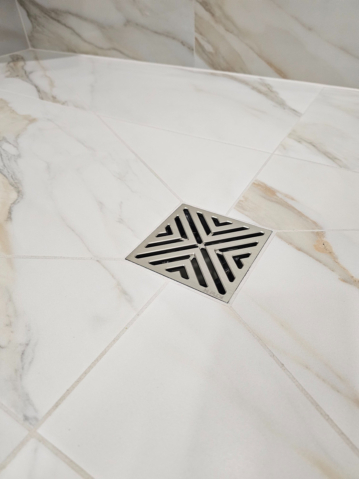 Finished — decorative square drain in Calacatta marble shower floor Inverness IL