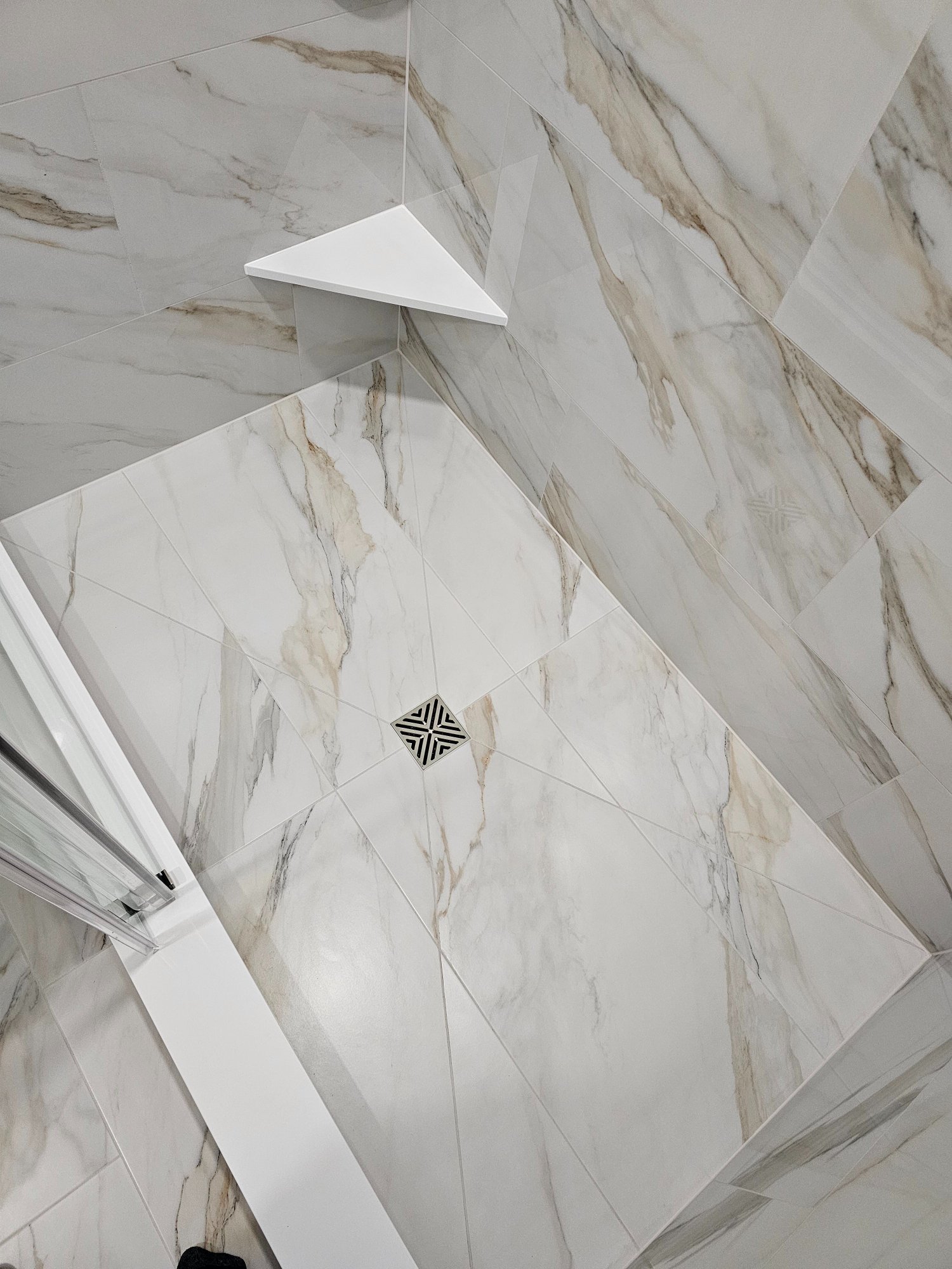 Finished — shower floor overhead with corner shelf and drain Inverness IL