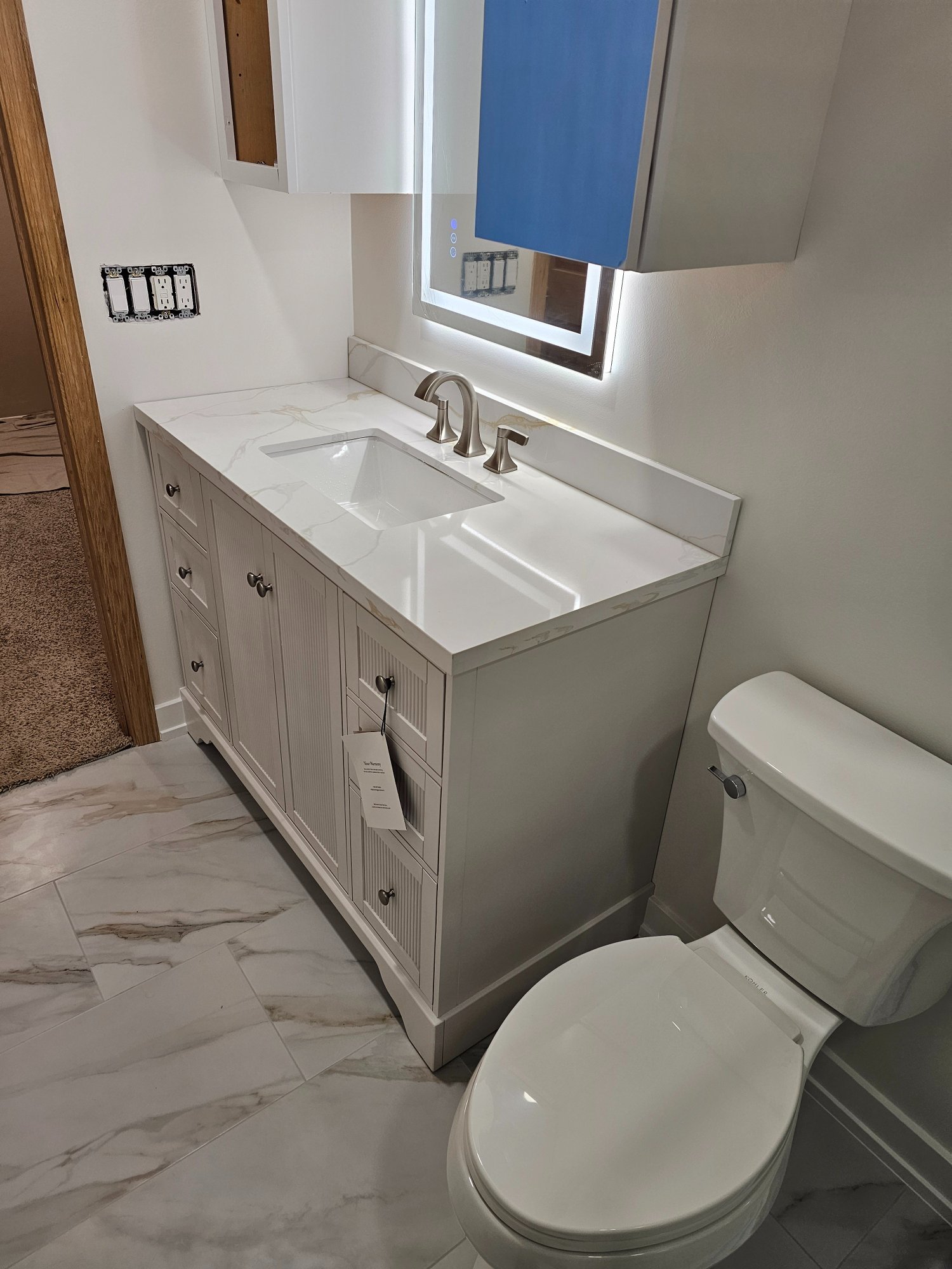 Finished — vanity with Calacatta quartz top and LED backlit mirror Inverness IL