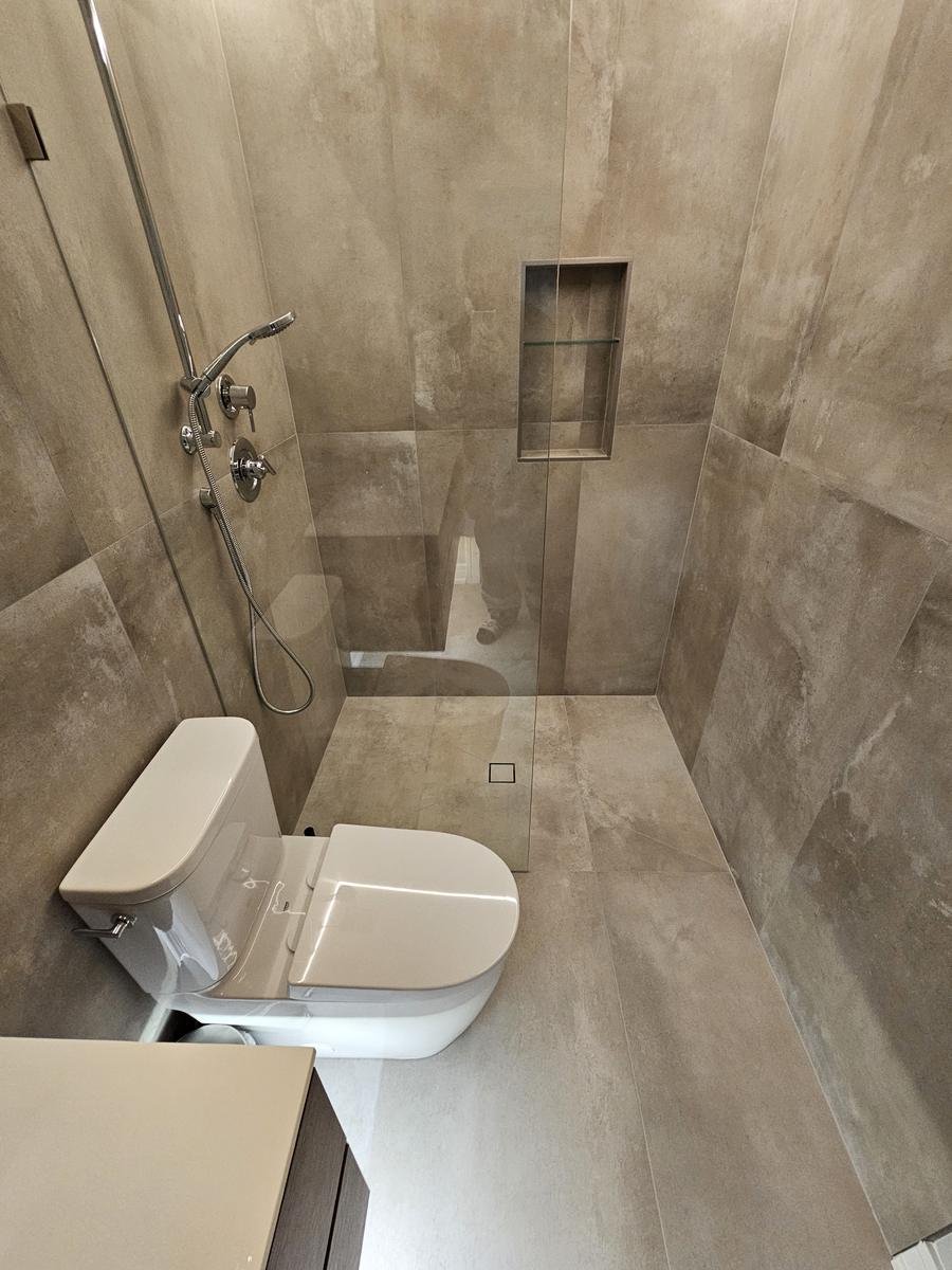 Curbless shower tile detail Lake Zurich IL — large-format porcelain tile with minimal grout lines