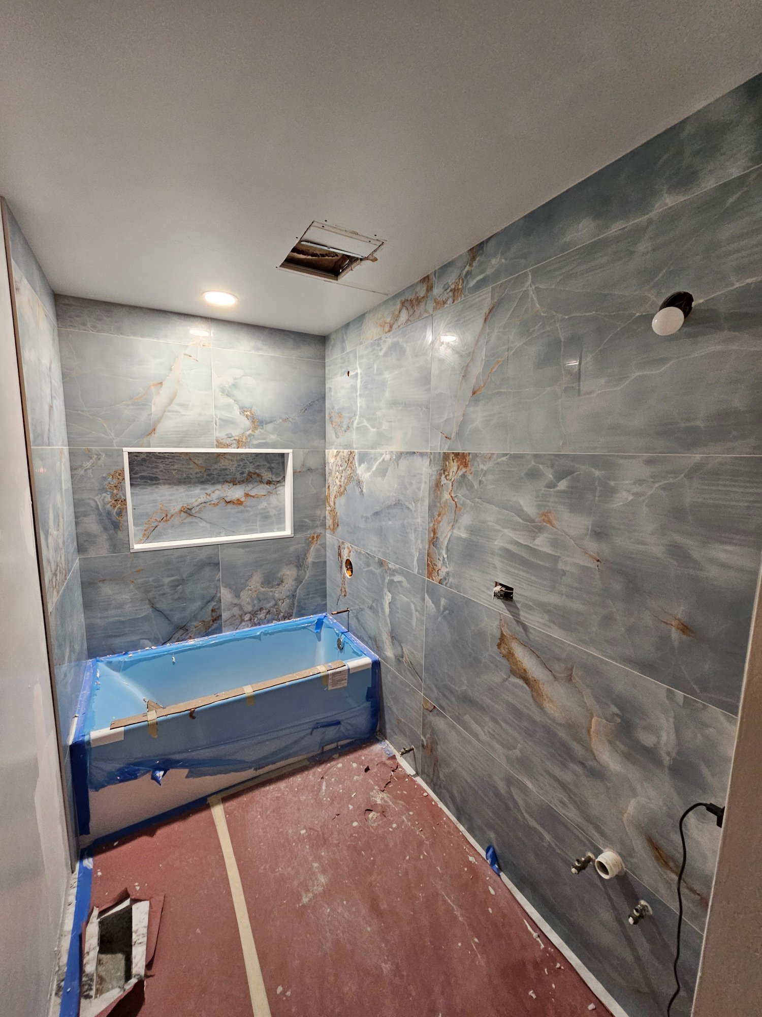 Large-format blue onyx tile walls with new tub — Schaumburg IL