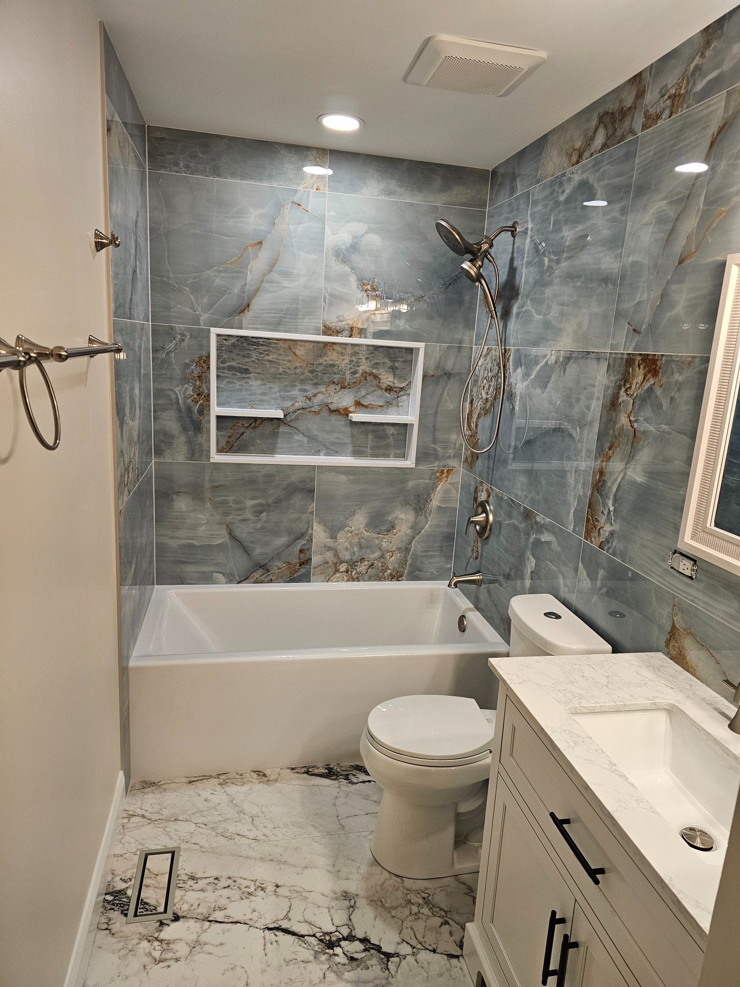 New soaking tub with blue onyx surround and brushed nickel fixtures — Schaumburg IL