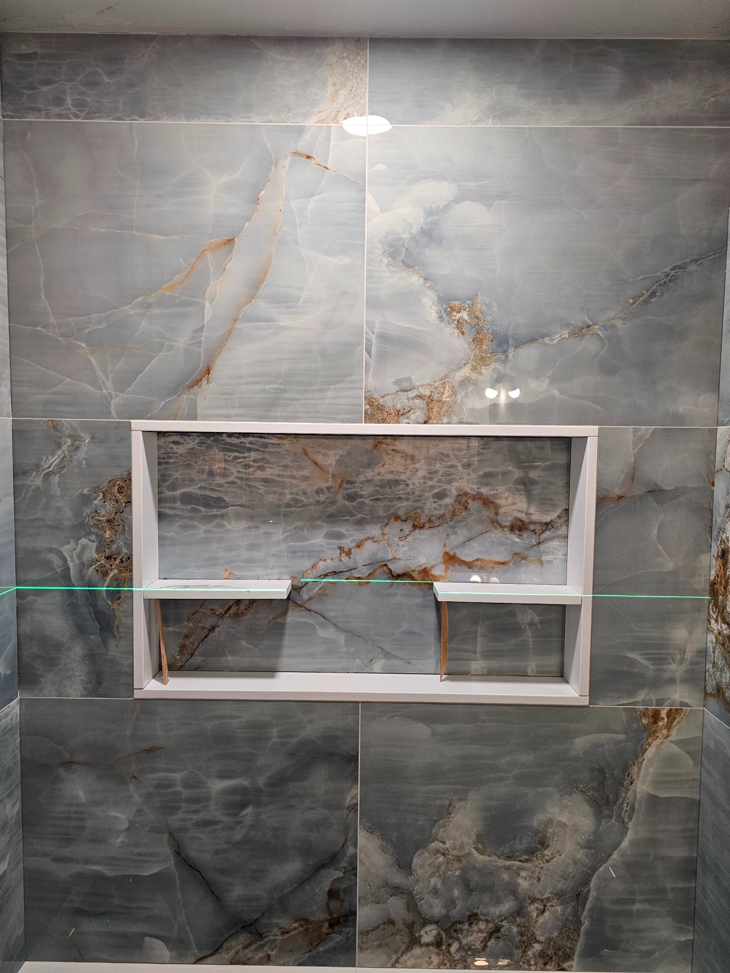 Custom double-shelf shower niche with blue onyx tile — Schaumburg IL