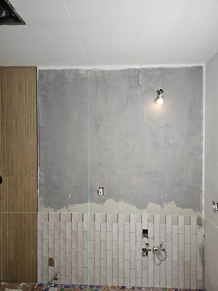 Vanity wall tile in progress — bathroom remodel Barrington IL