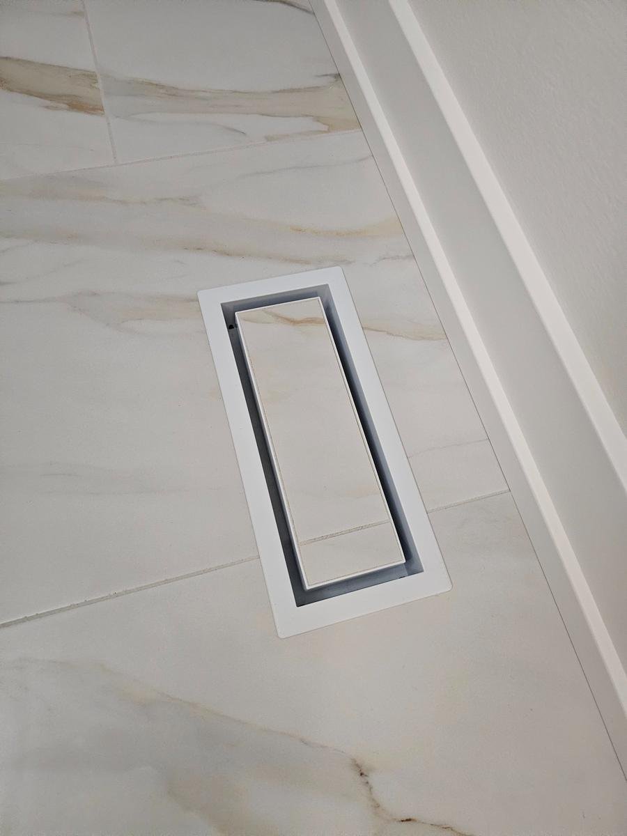 Tile-matched linear drain Inverness IL — precision drain installation with Calacatta marble cover