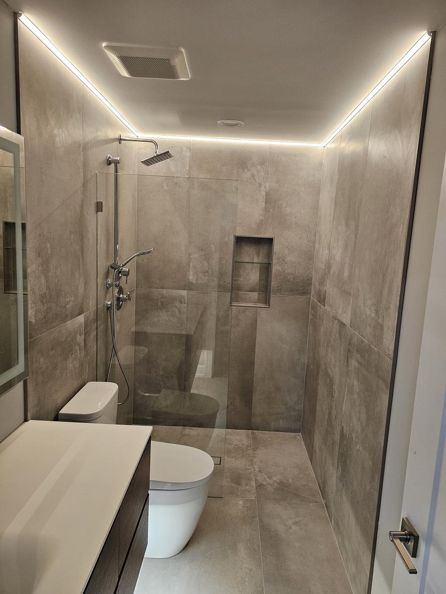 Curbless shower transition detail Lake Zurich IL — flush floor entry with recessed linear drain