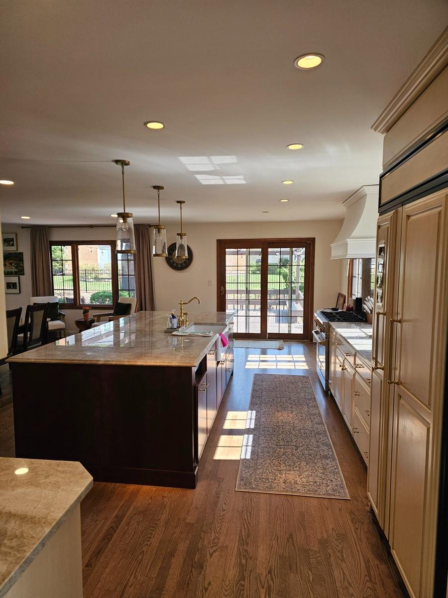 Large kitchen island Arlington Heights IL — open-concept layout with hardwood floors and custom cabinetry
